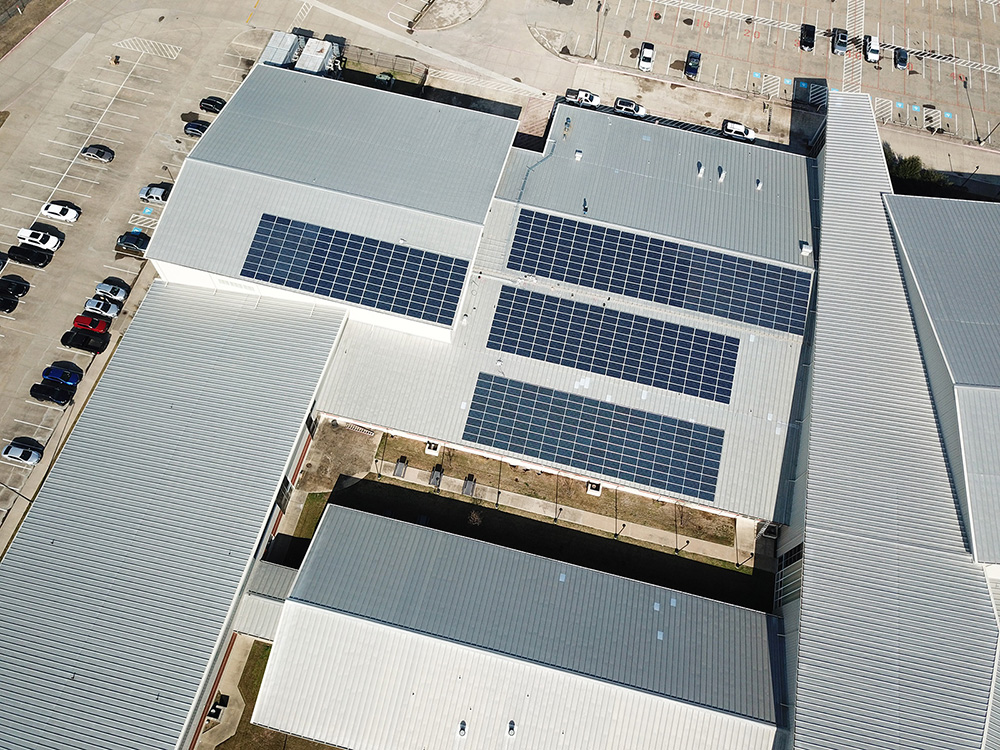 Auto dealership rooftop fitted with commercial solar panels