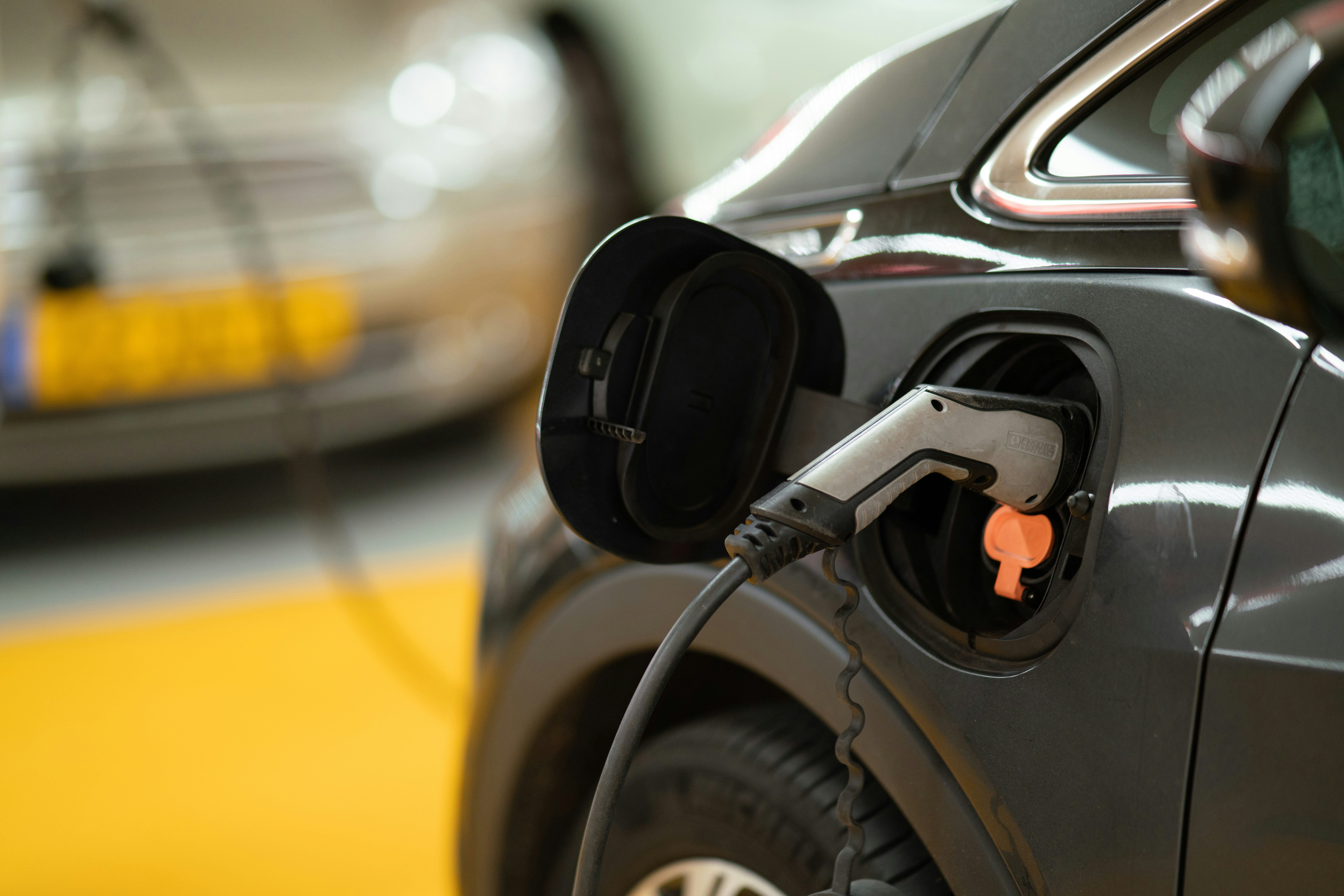Level 2 commercial EV charging station mounted in a Canadian workplace parking area